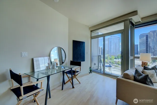 a living room with furniture and a wooden floor
