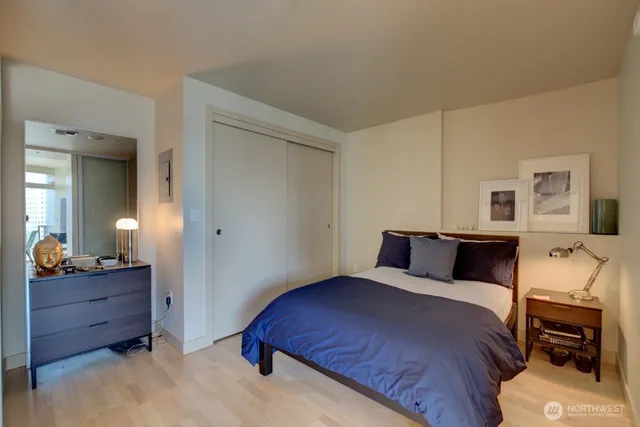 a bedroom with a bed and a dresser