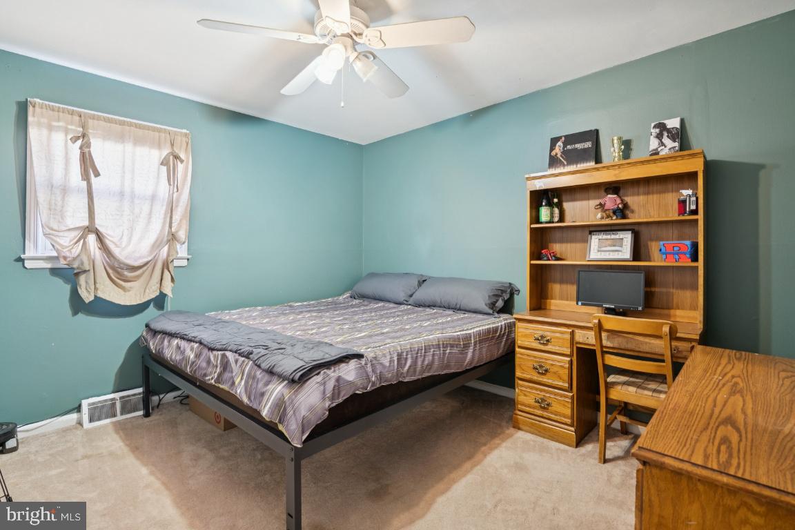 21 Paul Road Maple Shade, NJ 08052 - Photo 18 of 25 a bedroom with a bed and a chandelier