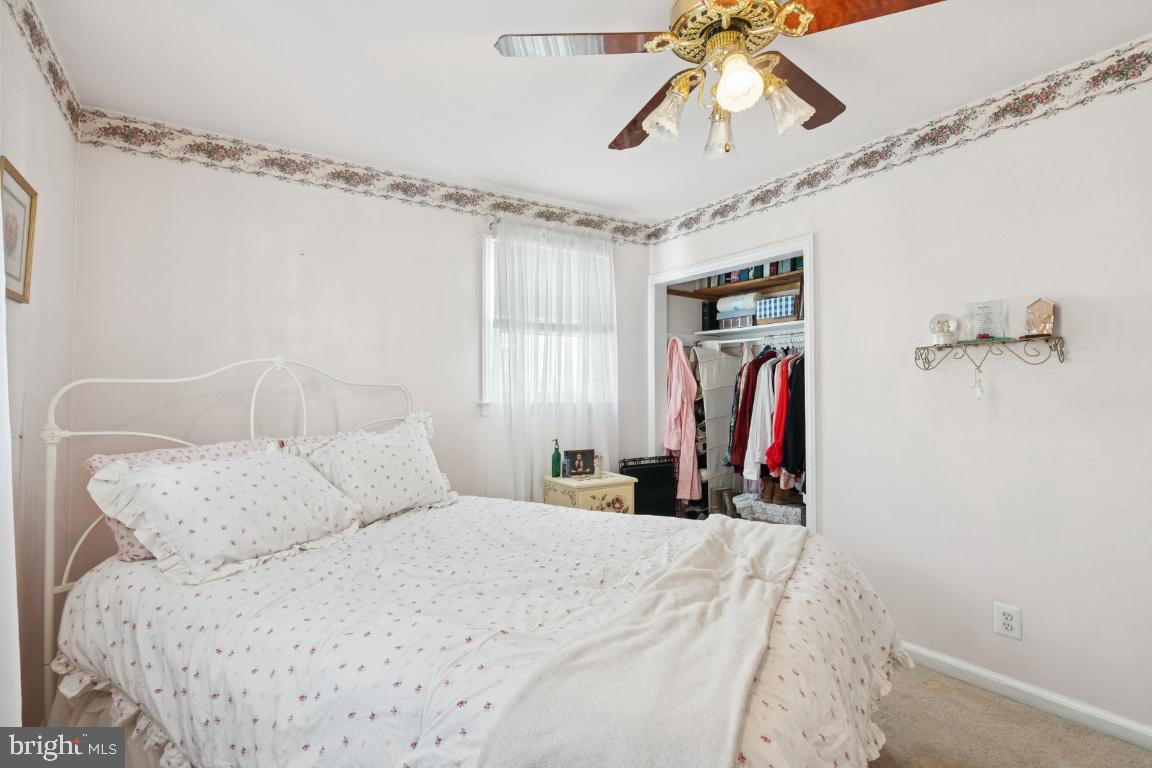 21 Paul Road Maple Shade, NJ 08052 - Photo 21 of 25 a bedroom with a bed and a chandelier