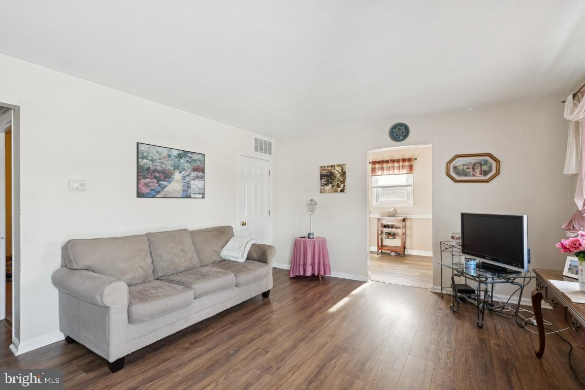 21 Paul Road Maple Shade, NJ 08052 - Photo 4 of 25 a living room with furniture and a flat screen tv