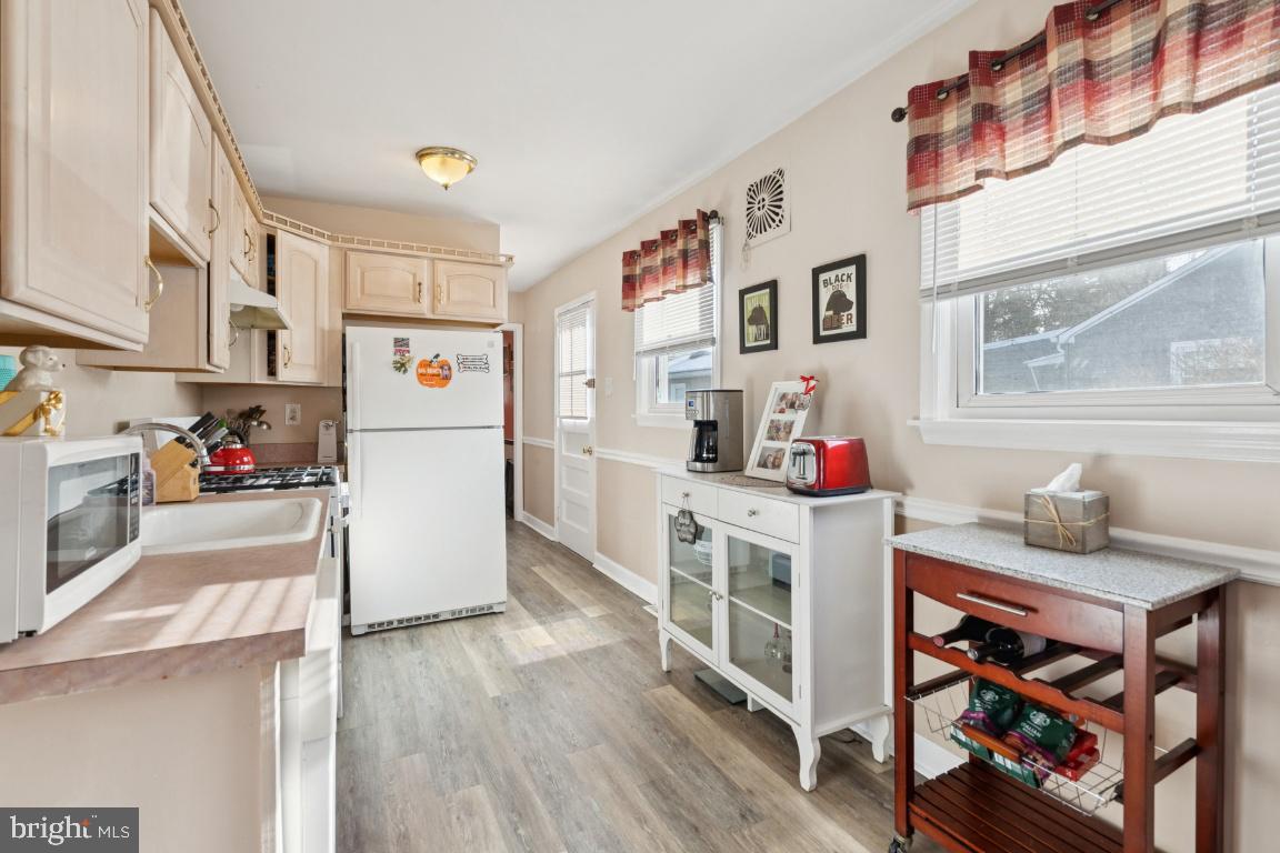 21 Paul Road Maple Shade, NJ 08052 - Photo 7 of 25 a kitchen with refrigerator and window