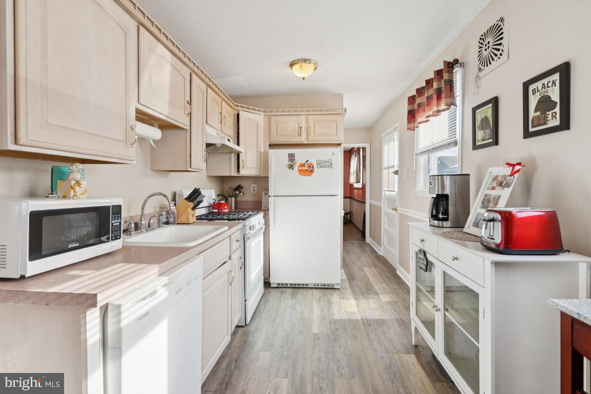 21 Paul Road Maple Shade, NJ 08052 - Photo 8 of 25 a kitchen with stainless steel appliances a refrigerator sink and cabinets