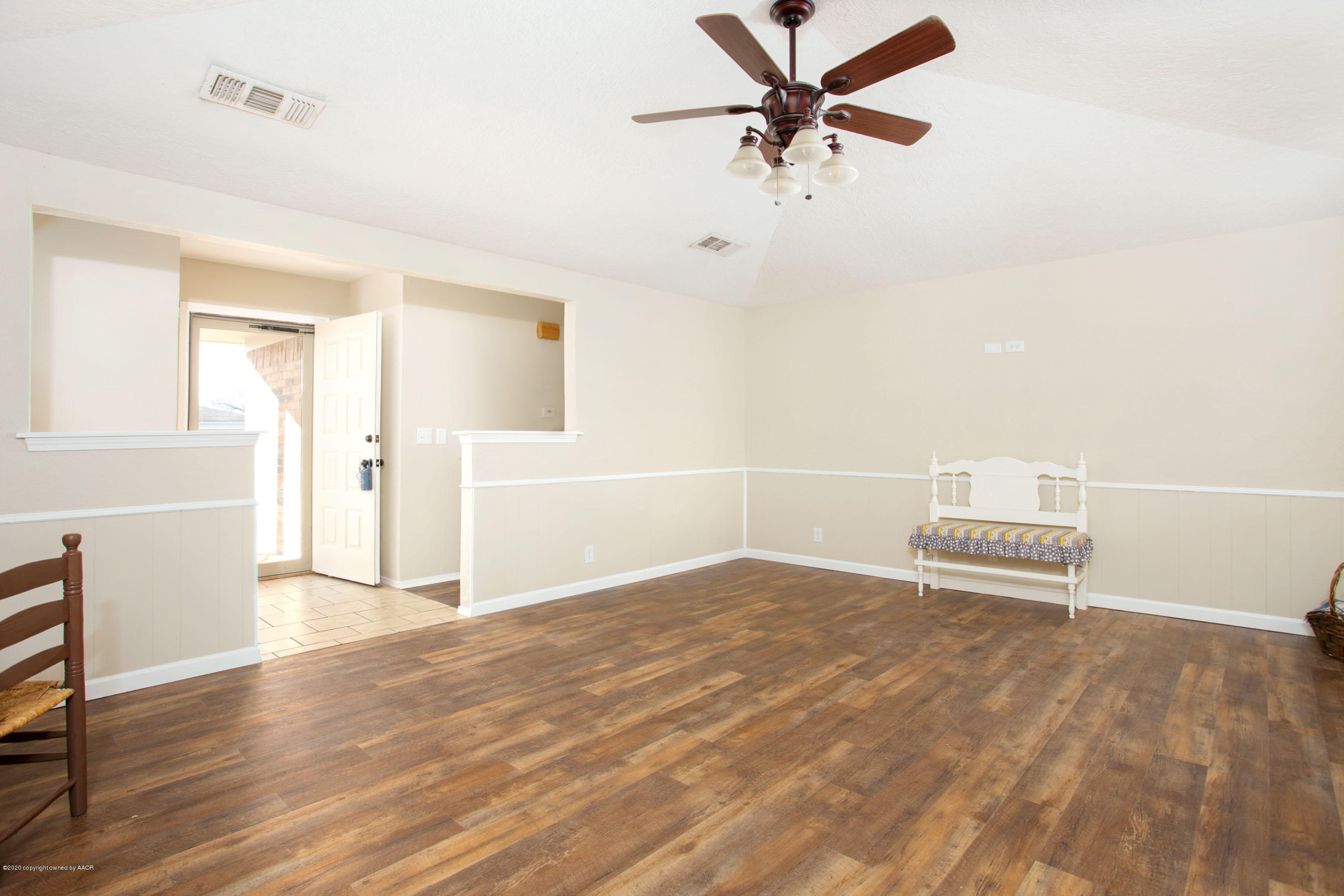5104 Pin Oak Drive Amarillo, TX 79110 - Photo 19 of 20 an empty room with wooden floor fan and windows