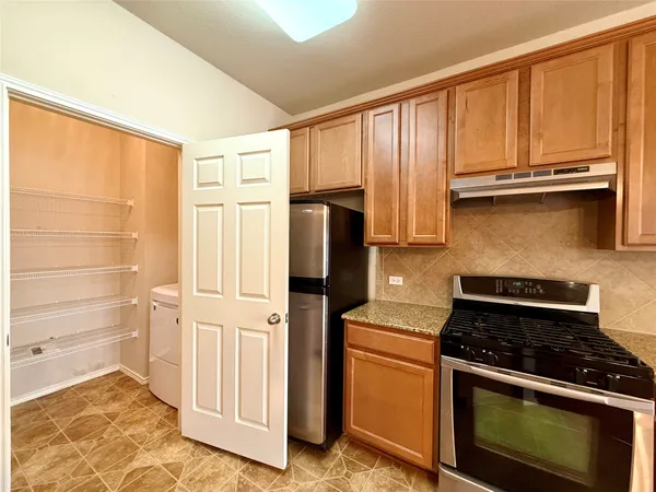 a bathroom with a washer and dryer