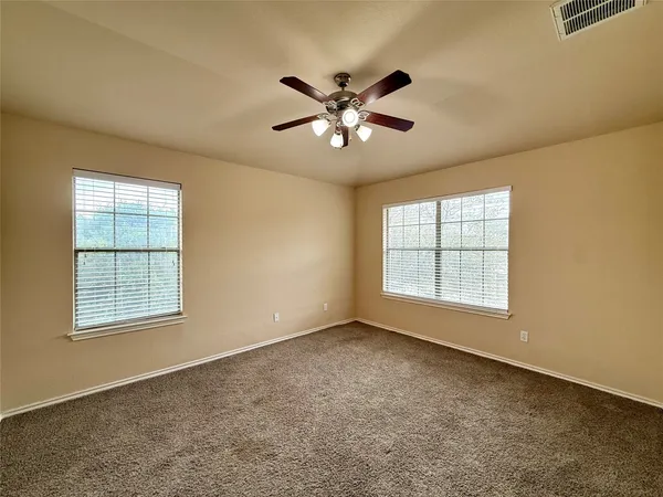 a bathroom with a tub a sink and a large mirror