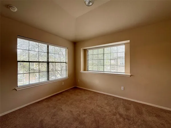a view of balcony with wooden floor and fence