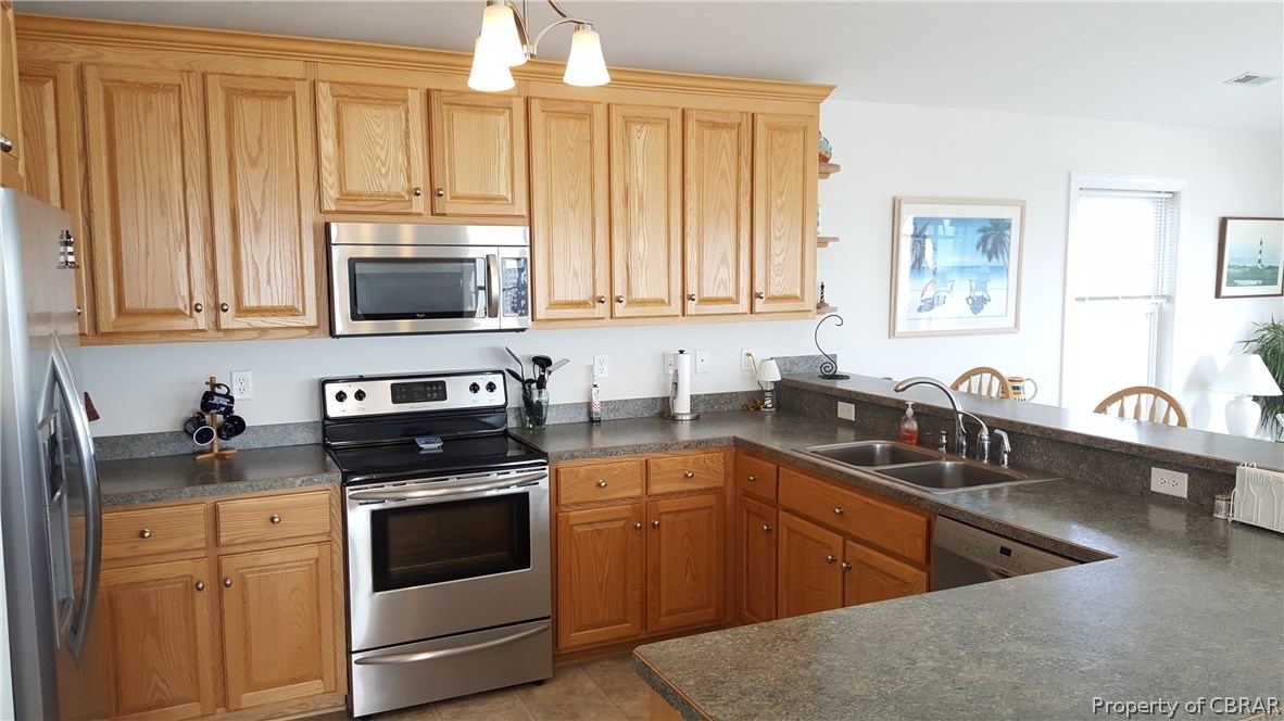 8 Chesapeake Shore Road Port Haywood, VA 23138 - Photo 7 of 26 Bright and open kitchen - bar seating for 3 or 4 in addition to dining room. All SS appliances.