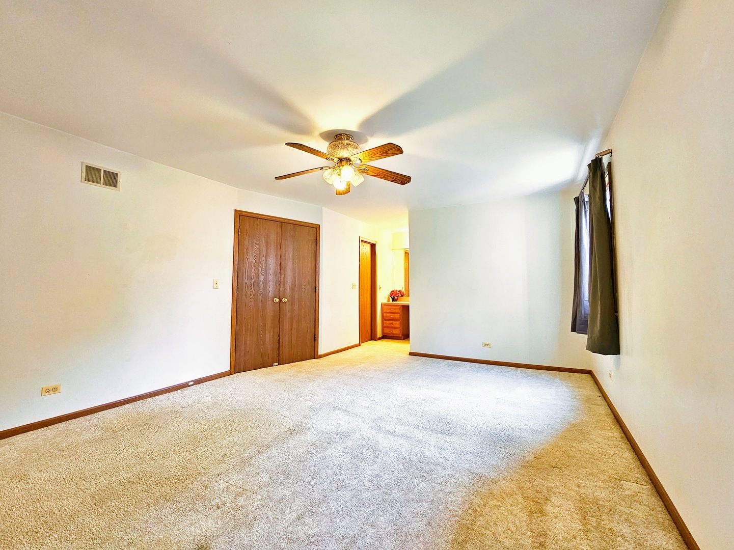2434 Red Bud Court Aurora, IL 60502 - Photo 15 of 16 a view of an empty room with a ceiling fan