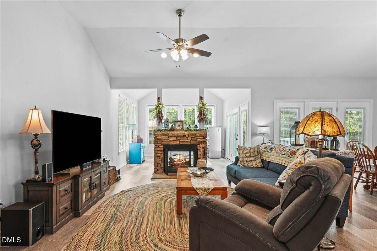 3331 Swinford Court Raleigh, NC 27604 - Photo 8 of 27 a living room with furniture and a flat screen tv