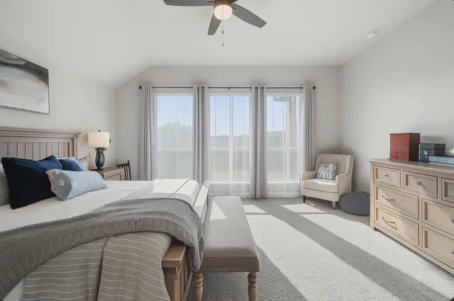 a spacious bathroom with a tub shower and mirror