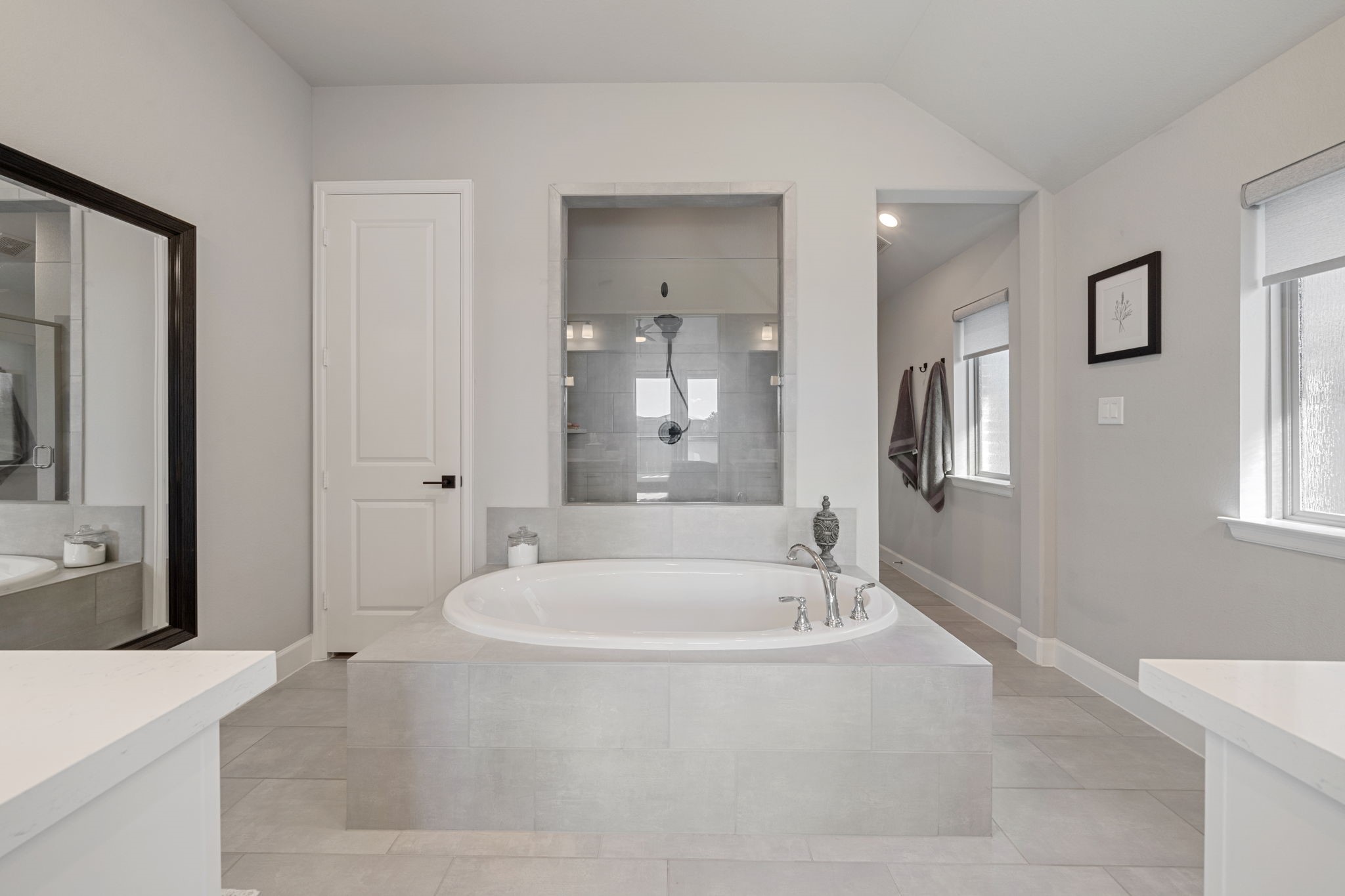 29726 Smoky Ridge Road Fulshear, TX 77441 - Photo 12 of 43 a spacious bathroom with a tub shower and mirror