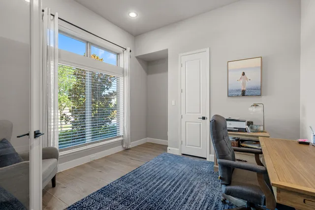 a bathroom with a sink a toilet a mirror and shower curtain