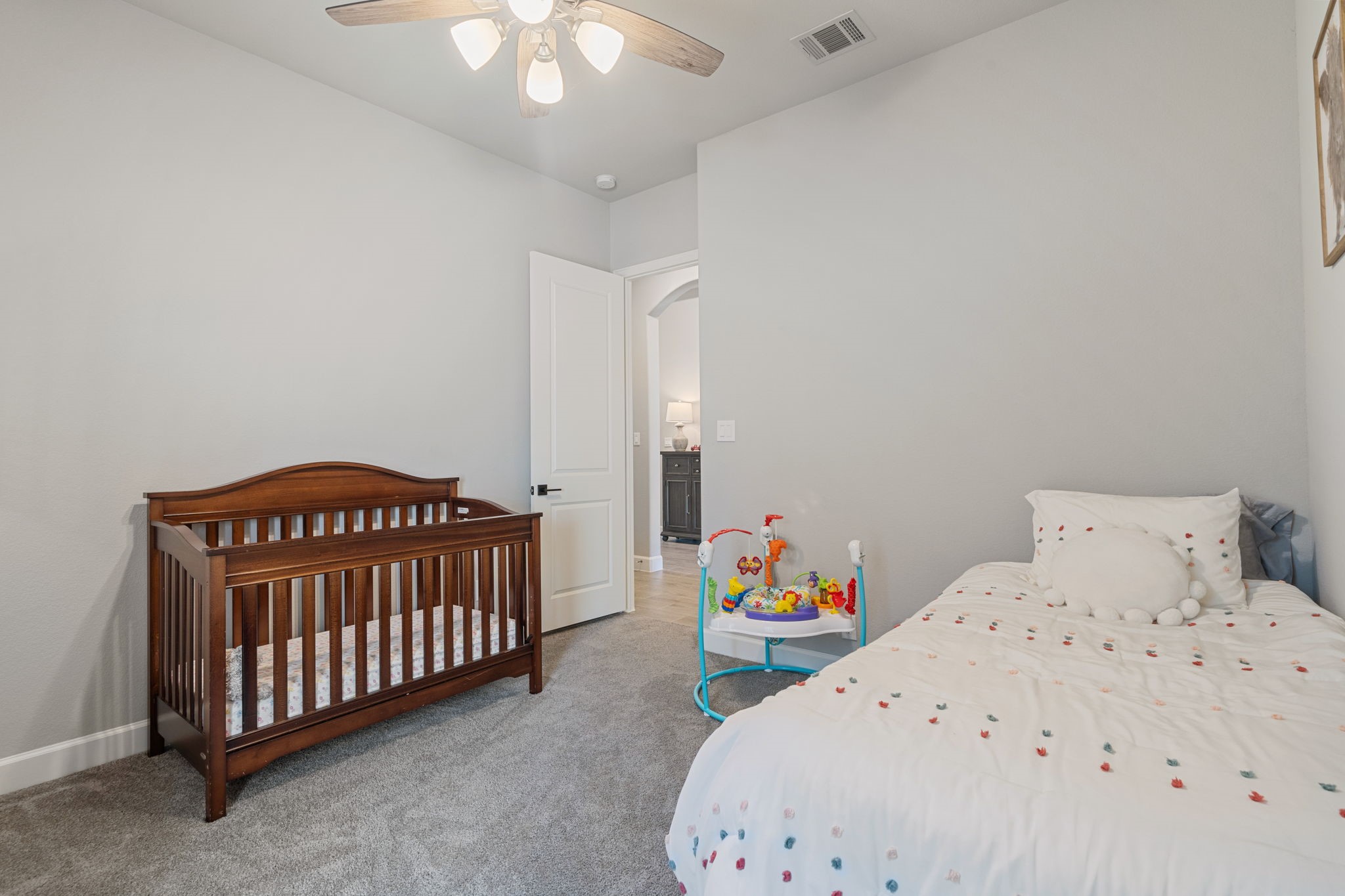 29726 Smoky Ridge Road Fulshear, TX 77441 - Photo 16 of 43 a bedroom with a bed and a baby crib