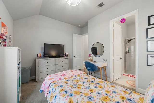 a bedroom with a bed and a closet