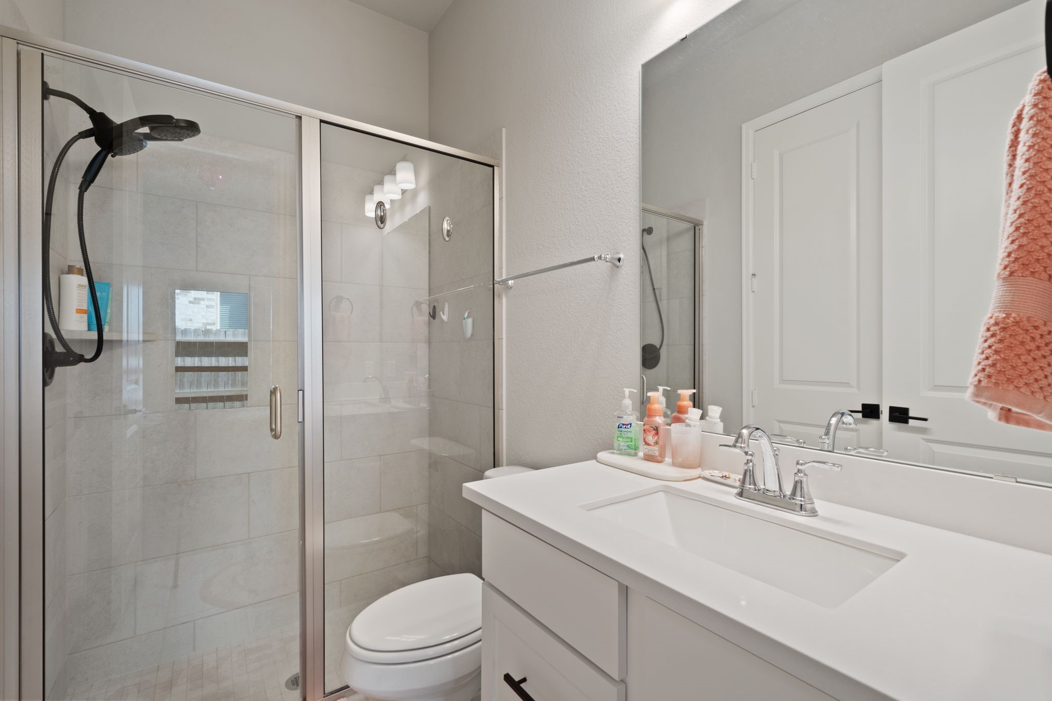 29726 Smoky Ridge Road Fulshear, TX 77441 - Photo 22 of 43 a bathroom with a sink vanity granite toilet and shower