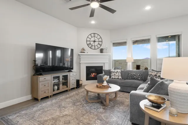 a living room with fireplace furniture and a fireplace
