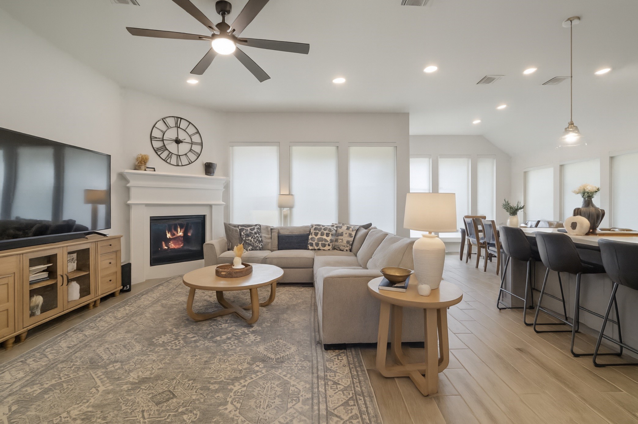 29726 Smoky Ridge Road Fulshear, TX 77441 - Photo 28 of 43 a living room with furniture a fireplace and a window