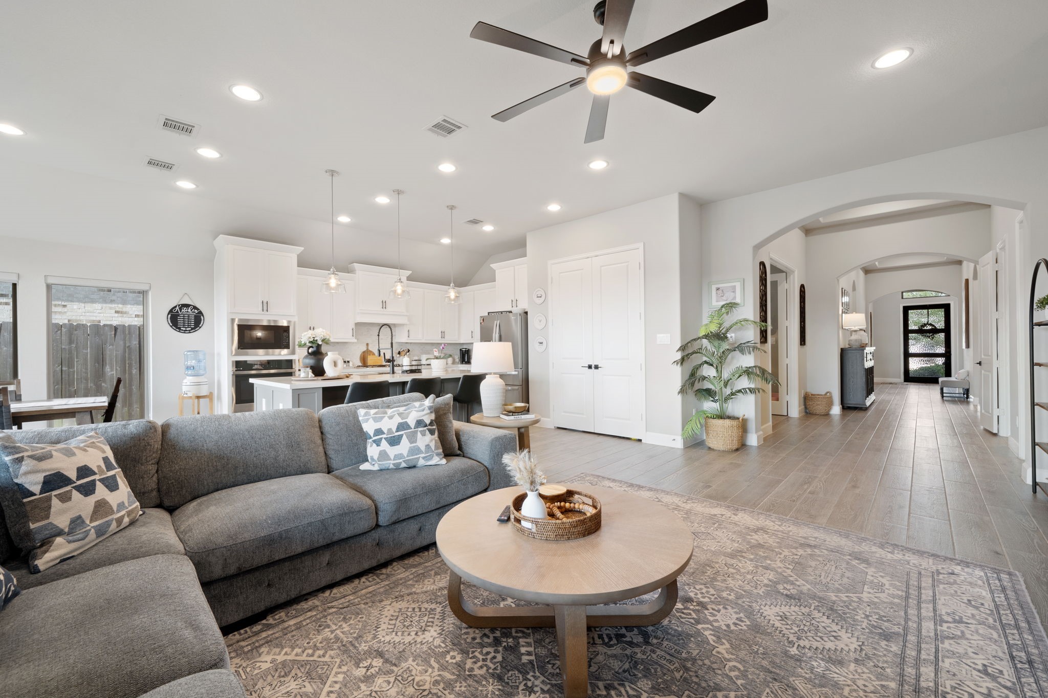 29726 Smoky Ridge Road Fulshear, TX 77441 - Photo 29 of 43 a living room with furniture and a view of kitchen
