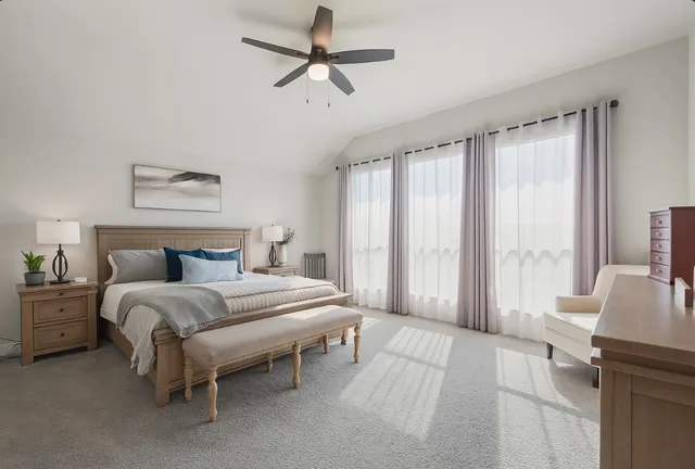 a spacious bathroom with a granite countertop sink mirror and bathtub