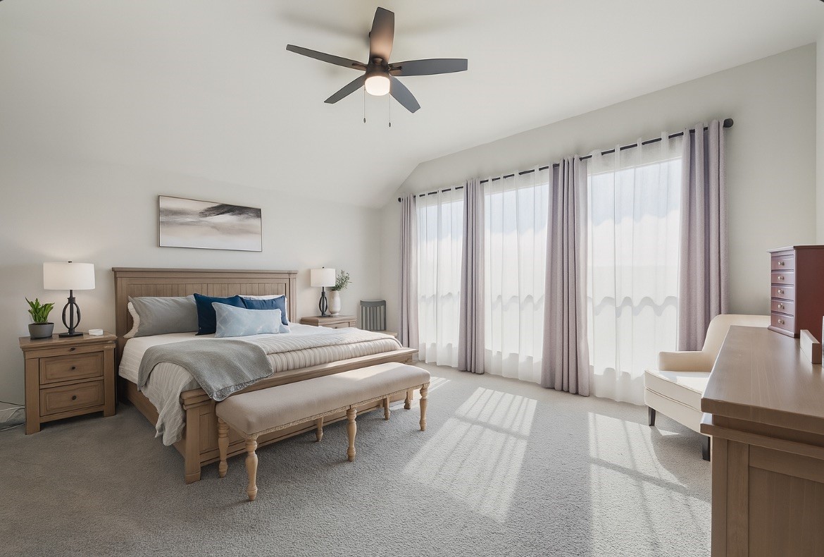 29726 Smoky Ridge Road Fulshear, TX 77441 - Photo 3 of 43 a spacious bedroom with a bed and a chandelier