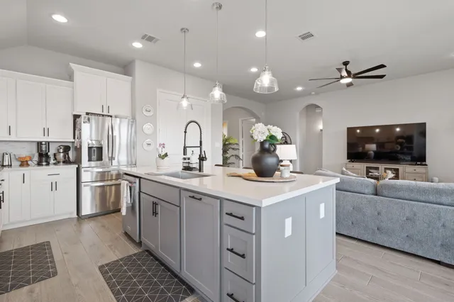 a view of a patio with couches chairs and a yard