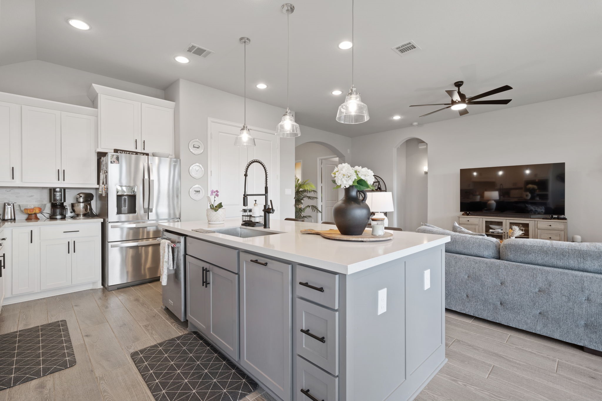 29726 Smoky Ridge Road Fulshear, TX 77441 - Photo 33 of 43 a view of a kitchen counter space a sink stainless steel appliances and cabinets