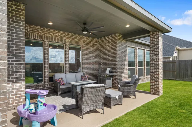 a view of a chairs and table in the patio
