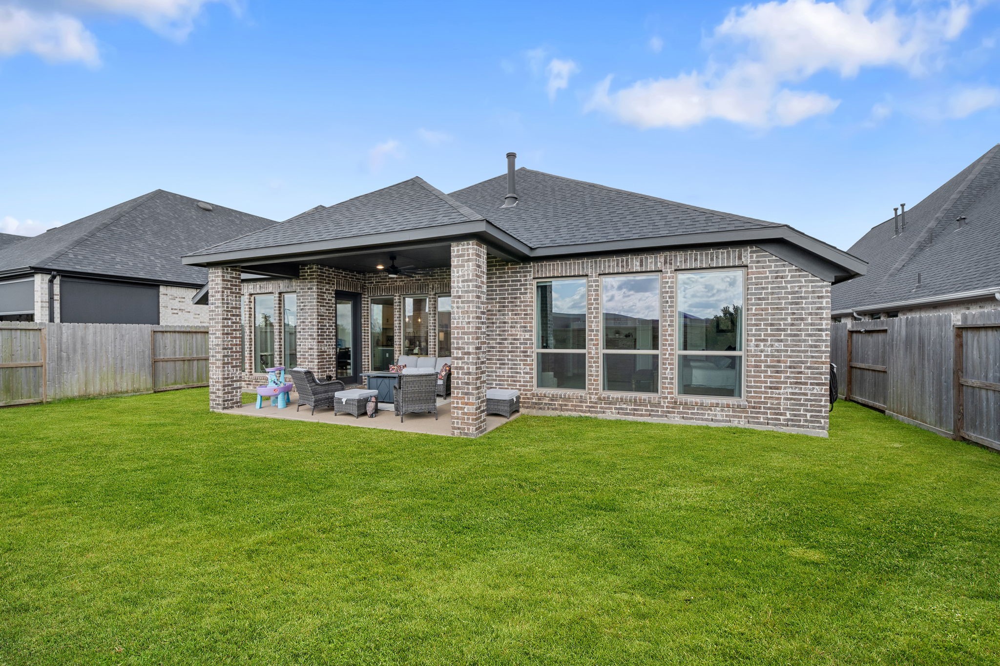 29726 Smoky Ridge Road Fulshear, TX 77441 - Photo 37 of 43 a view of a house with a yard and sitting area