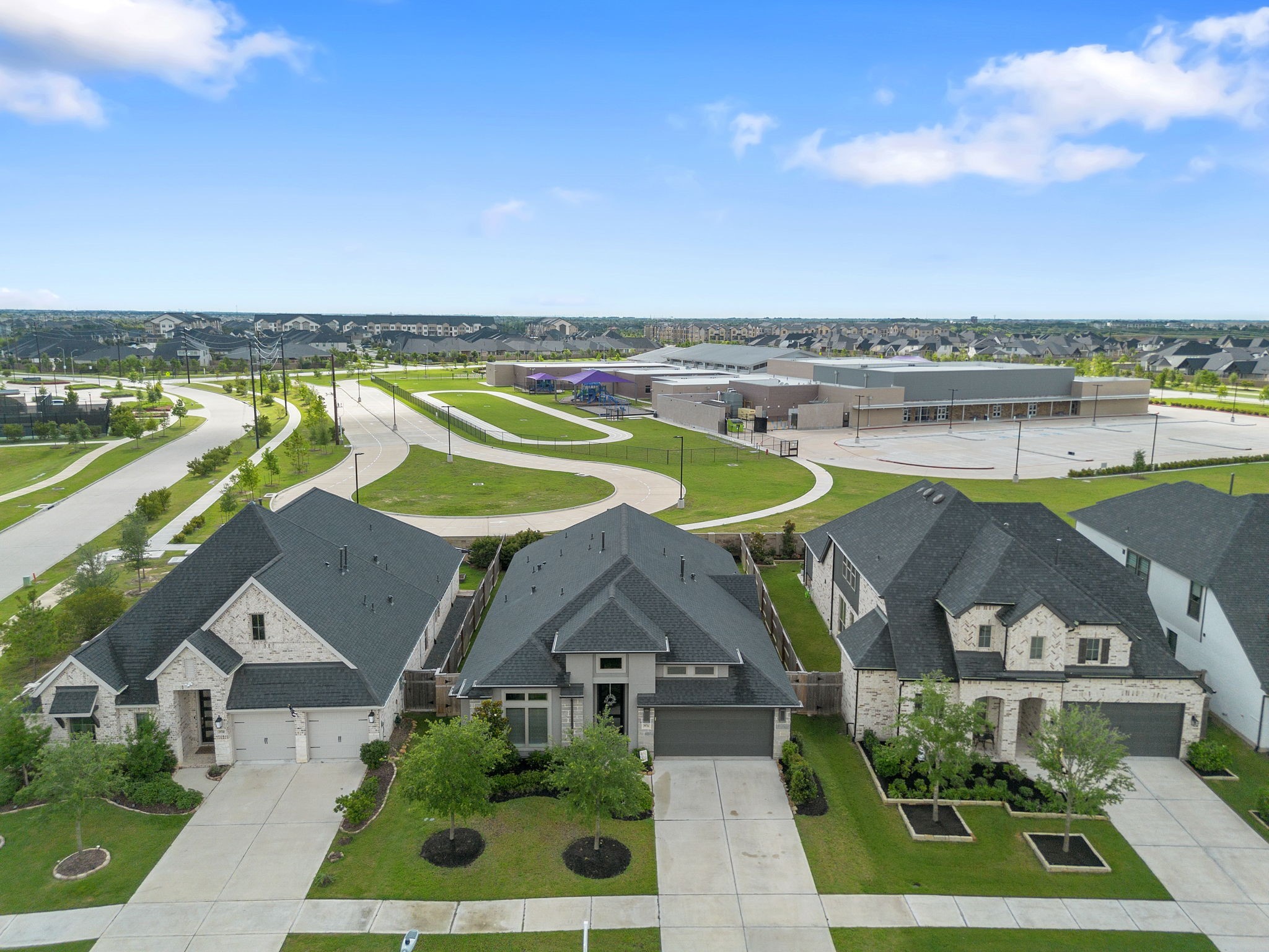 29726 Smoky Ridge Road Fulshear, TX 77441 - Photo 40 of 43 an aerial view of a house with outdoor space swimming pool and lake view
