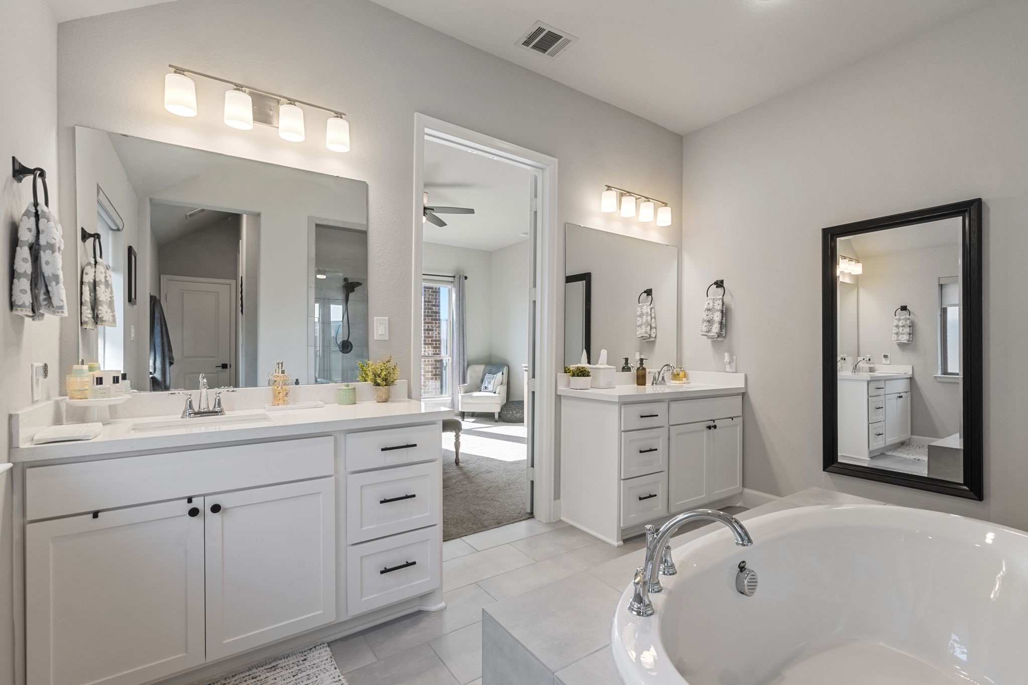 29726 Smoky Ridge Road Fulshear, TX 77441 - Photo 4 of 43 a spacious bathroom with a granite countertop sink mirror and bathtub
