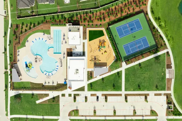 a front view of house and yard with green space