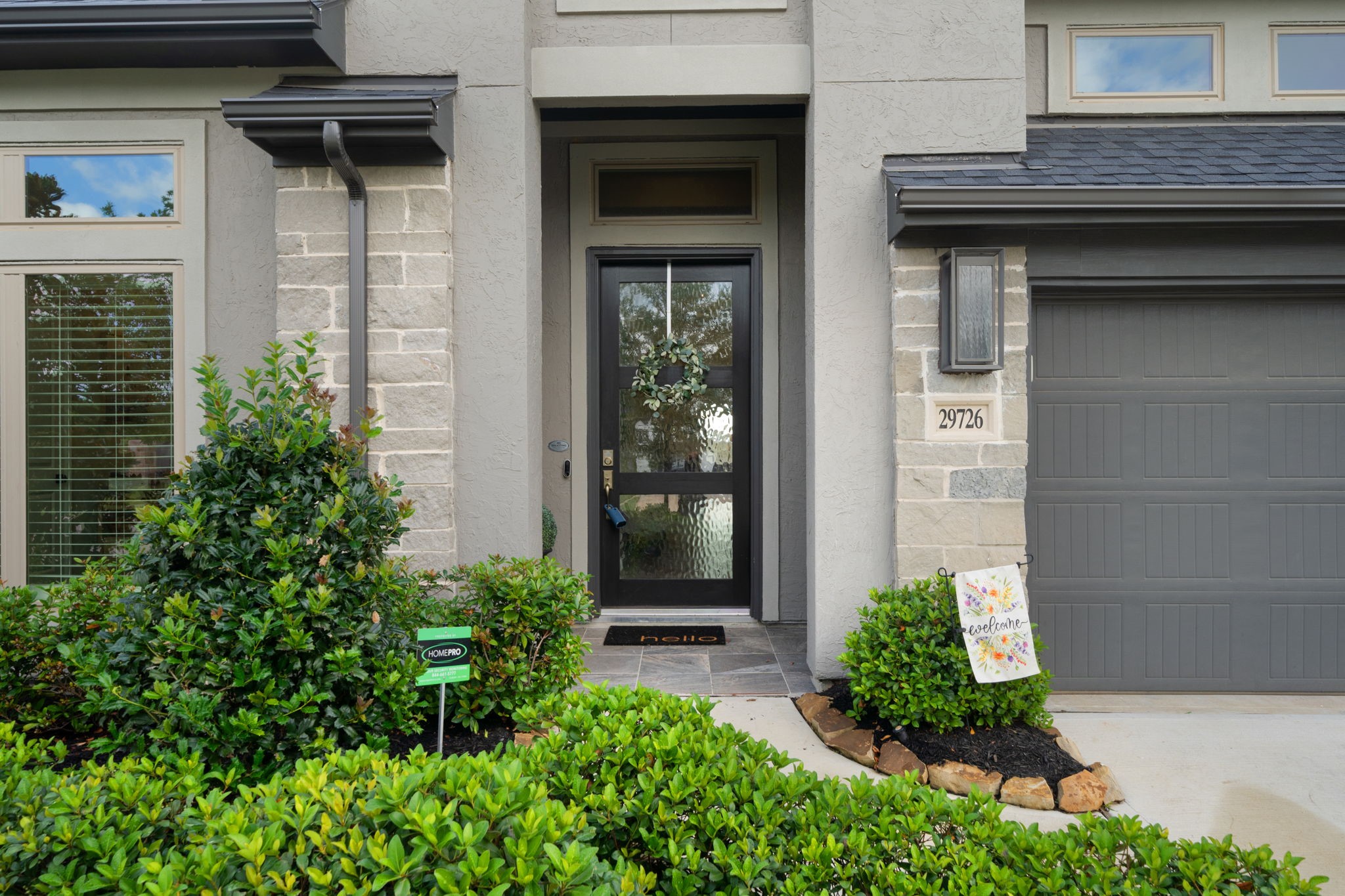 29726 Smoky Ridge Road Fulshear, TX 77441 - Photo 8 of 43 a view of a pathway of the house front of a house