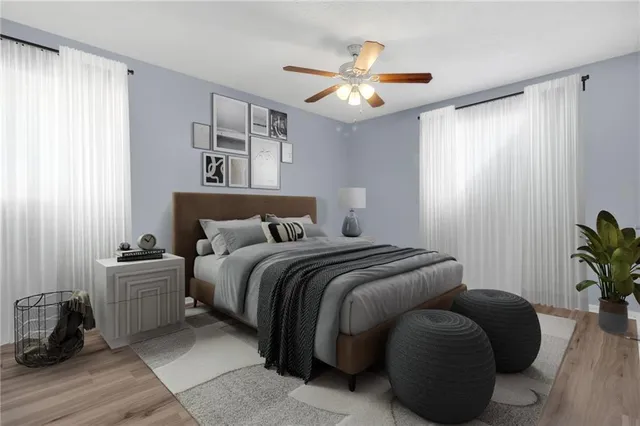 a bedroom with bed and window