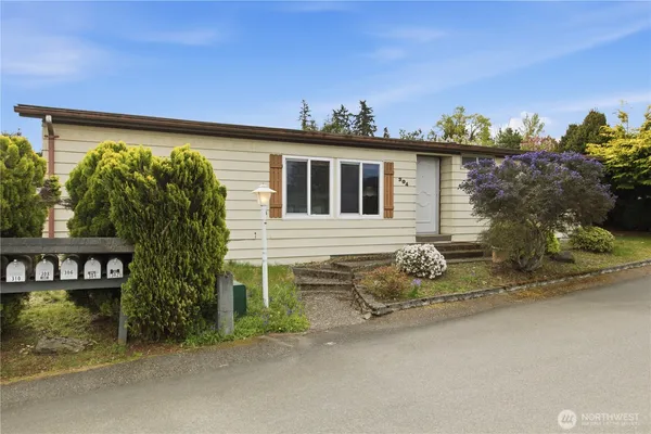 front view of a house with a yard