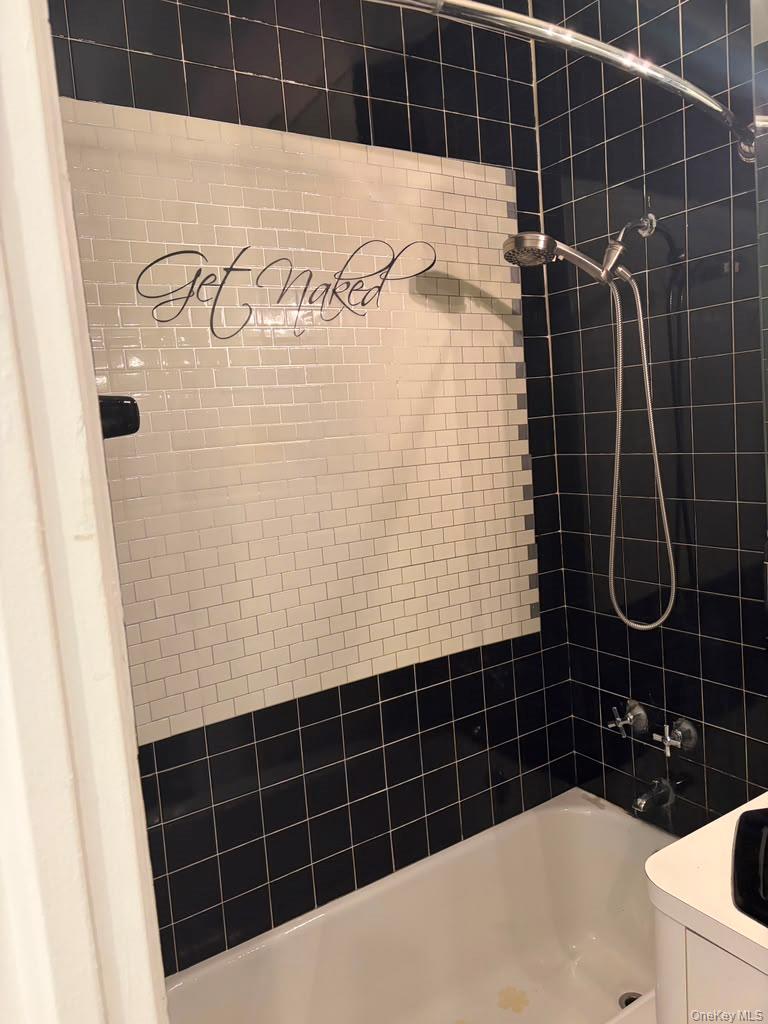 99-60 63rd Road, Unit 1H Queens, NY 11374 - Photo 7 of 11 a bathroom with a shower