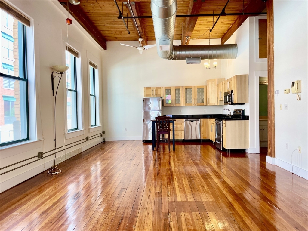 49 Munroe Street, Unit 201 Lynn, MA 01901 - Photo 11 of 16 a view of a room with wooden floor