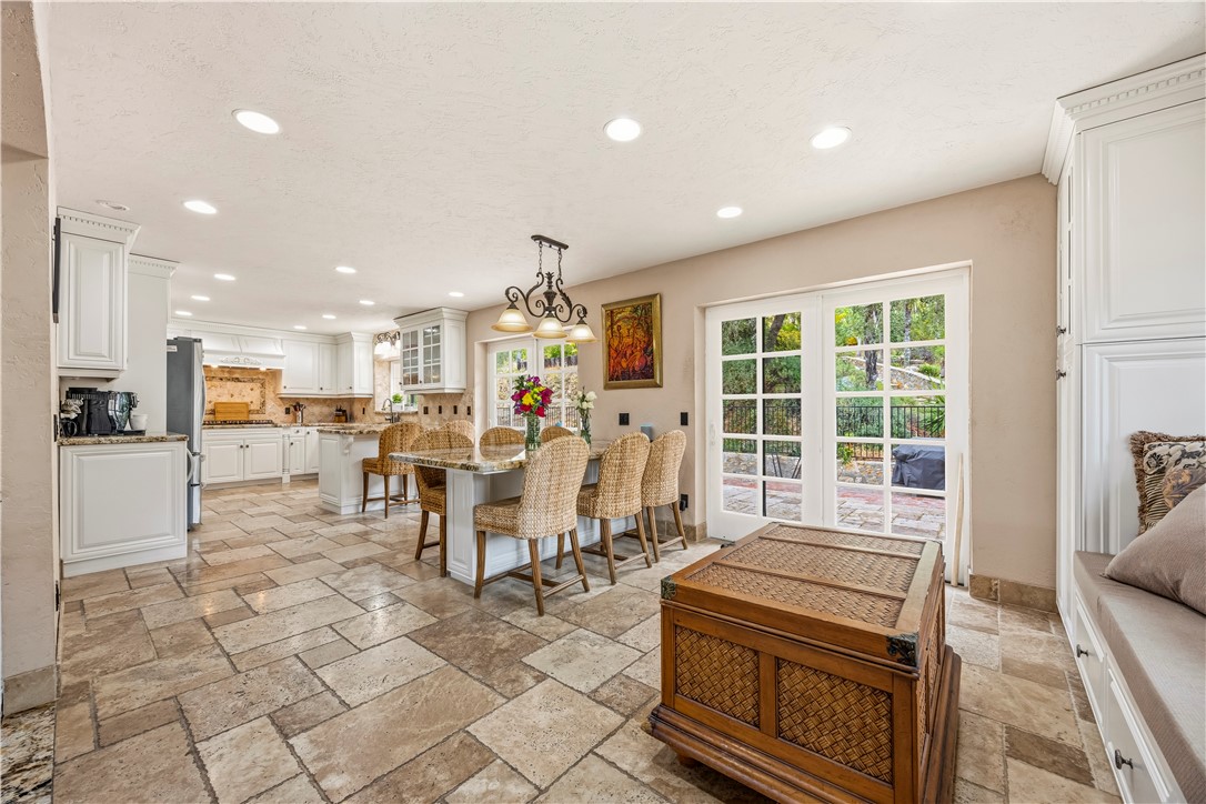 1485 Vía Ladera Fallbrook, CA 92028 - Photo 2 of 43 a kitchen with stainless steel appliances granite countertop a stove and a refrigerator