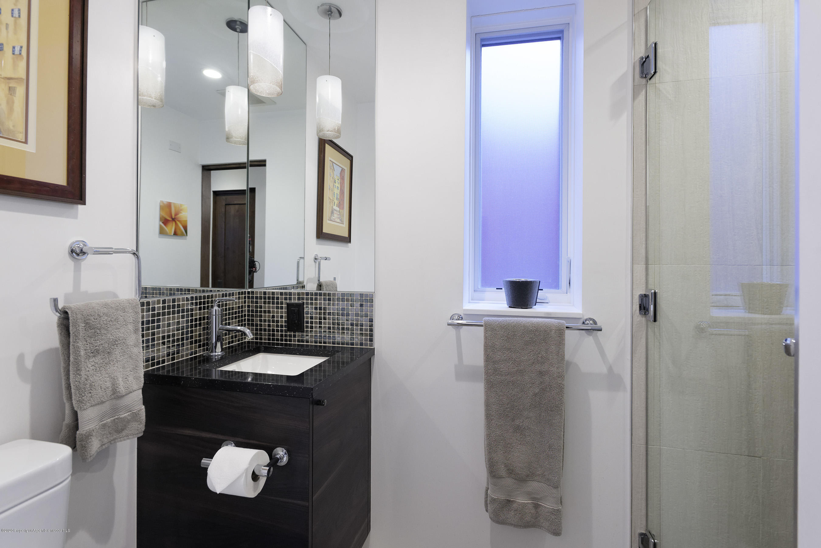 100 East Cooper Avenue, Unit 12 Aspen, CO 81611 - Photo 10 of 12 a bathroom with a sink and a mirror