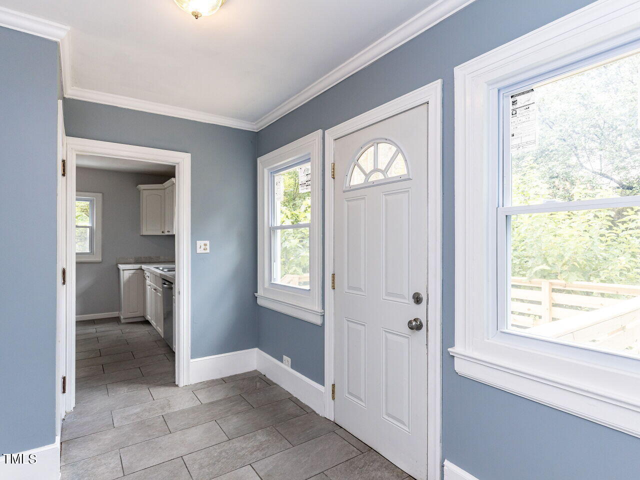 7 Ratcale Lane Durham, NC 27705 - Photo 16 of 33 a view of a hallway with windows and a bathroom