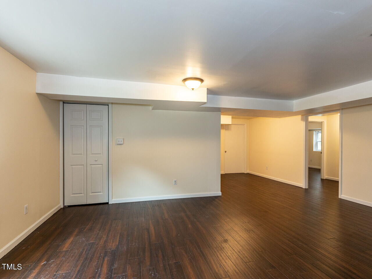 7 Ratcale Lane Durham, NC 27705 - Photo 20 of 33 an empty room with wooden floor and windows