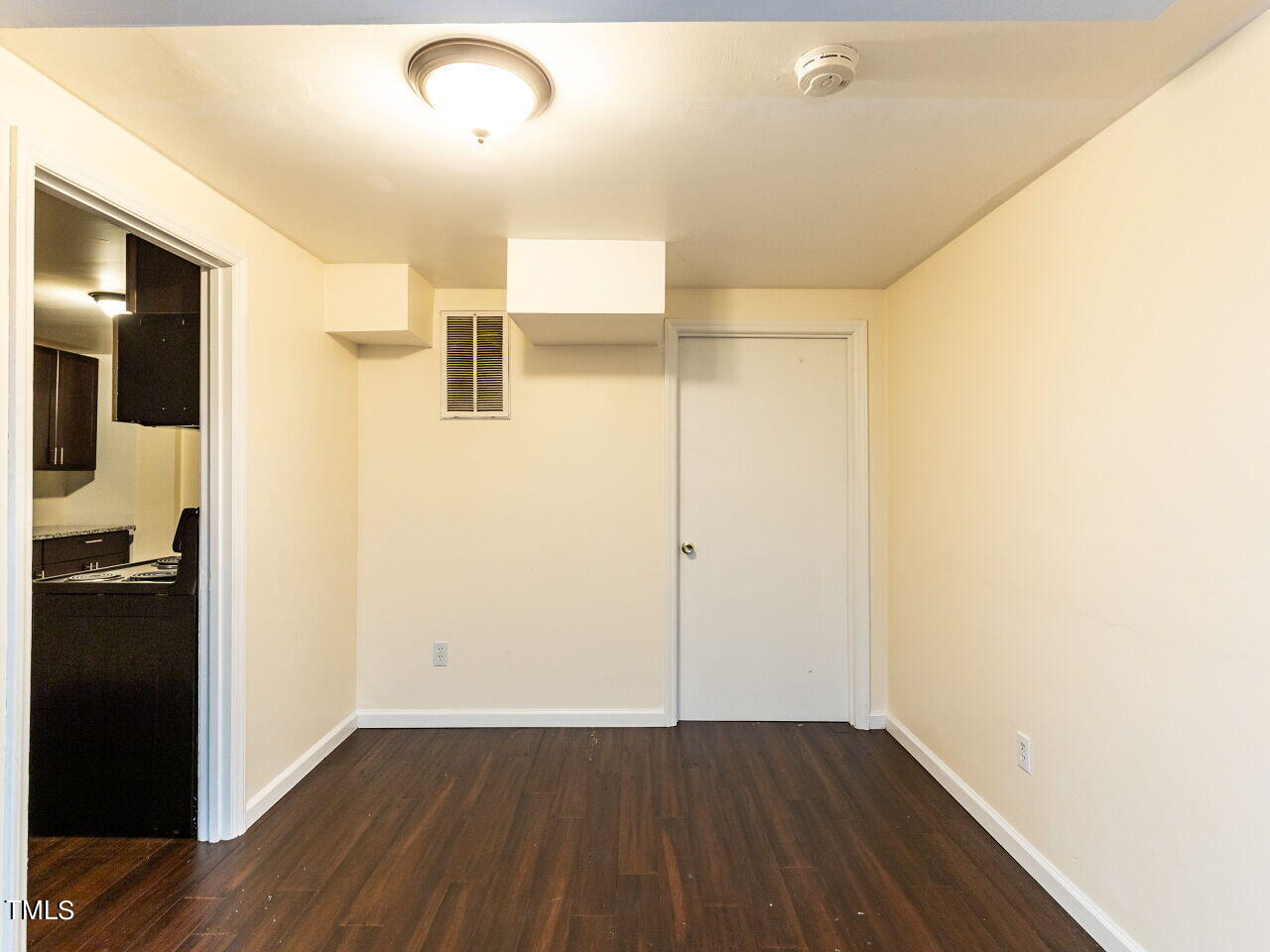 7 Ratcale Lane Durham, NC 27705 - Photo 22 of 33 a view of a hallway with wooden floor
