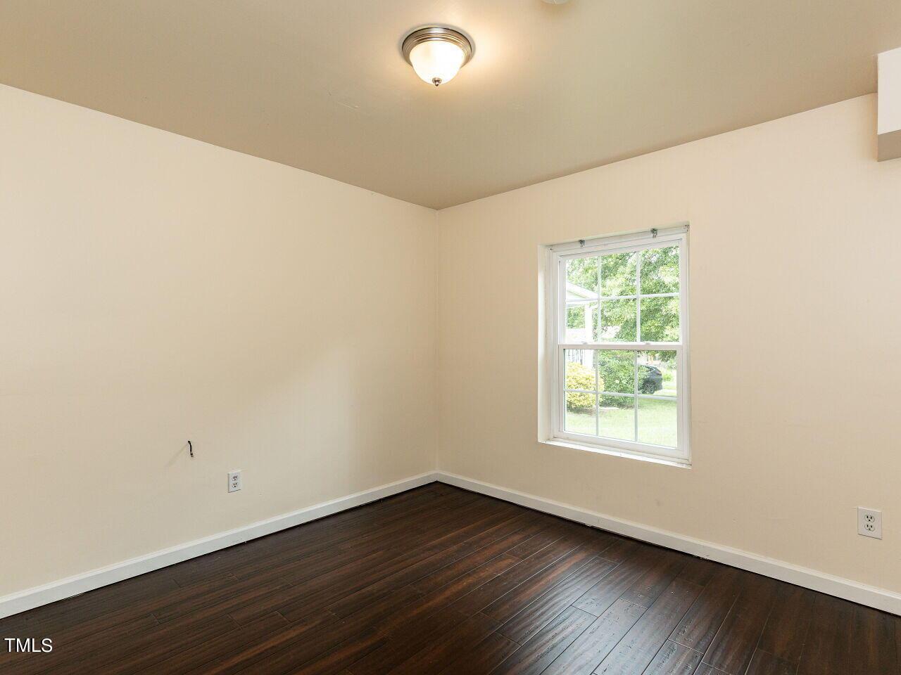 7 Ratcale Lane Durham, NC 27705 - Photo 26 of 33 an empty room with wooden floor and windows