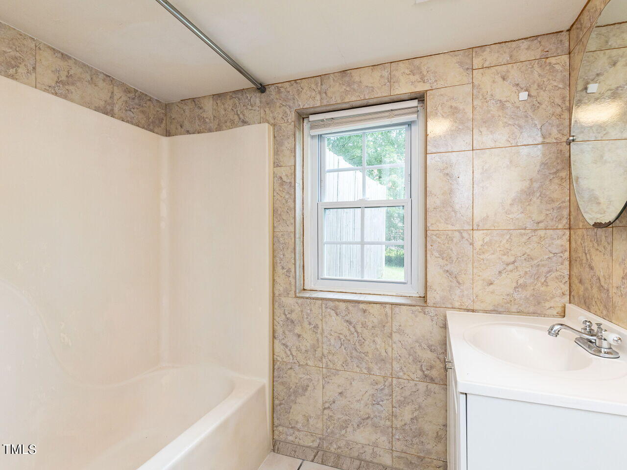 7 Ratcale Lane Durham, NC 27705 - Photo 28 of 33 a bathroom with a sink and a bathtub