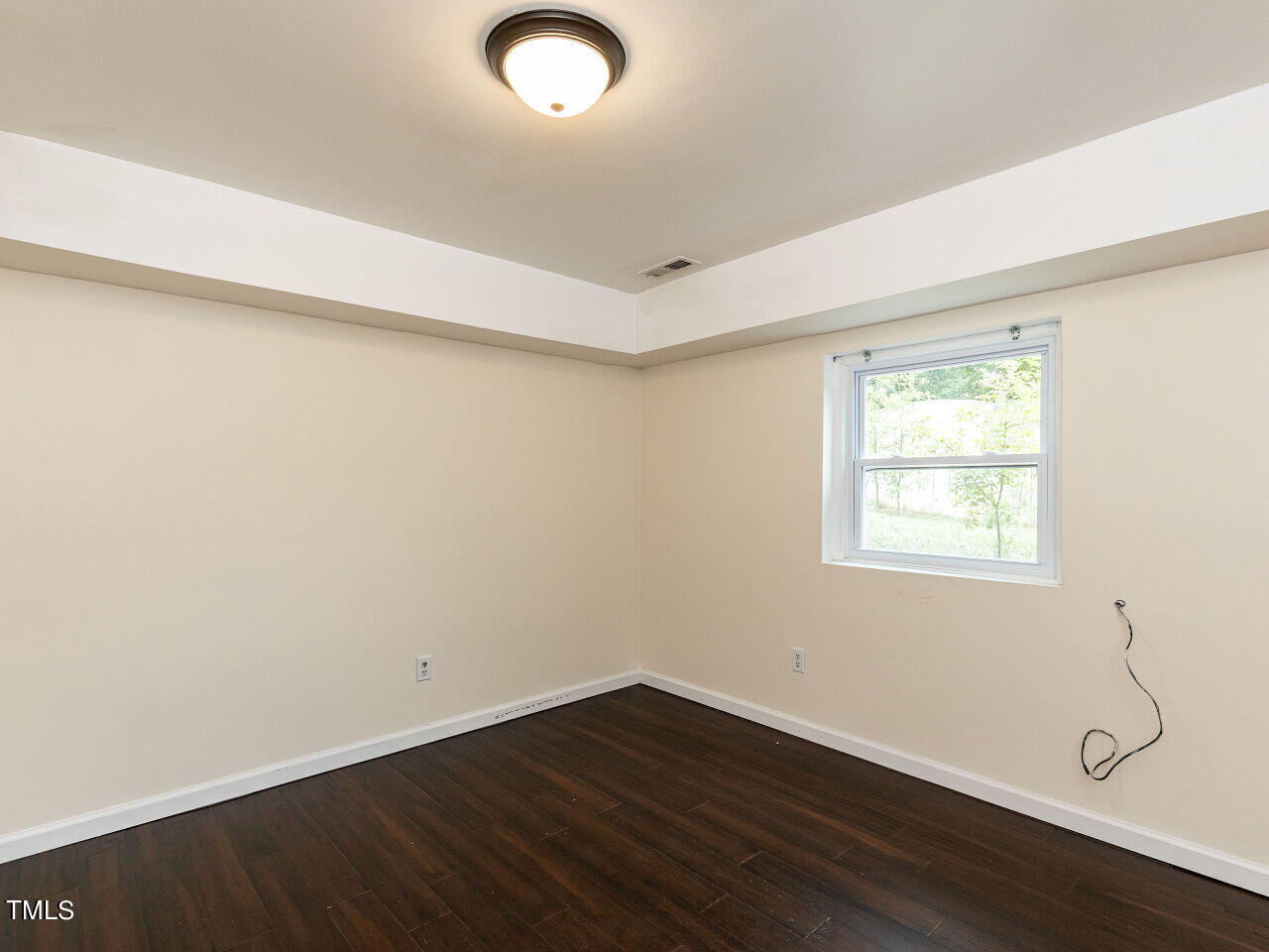 7 Ratcale Lane Durham, NC 27705 - Photo 29 of 33 an empty room with wooden floor and windows