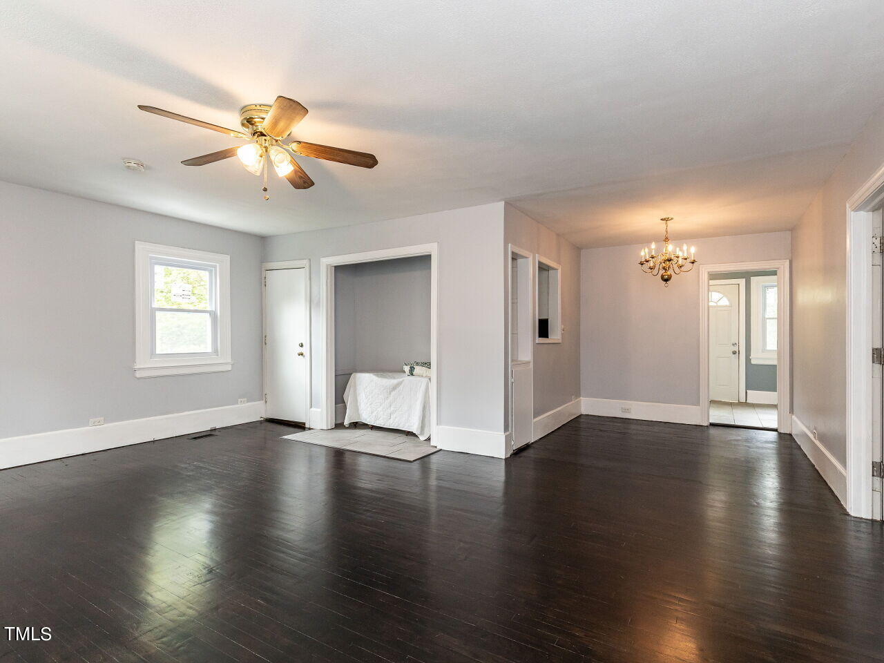 7 Ratcale Lane Durham, NC 27705 - Photo 3 of 33 a view of an empty room with wooden floor and a window