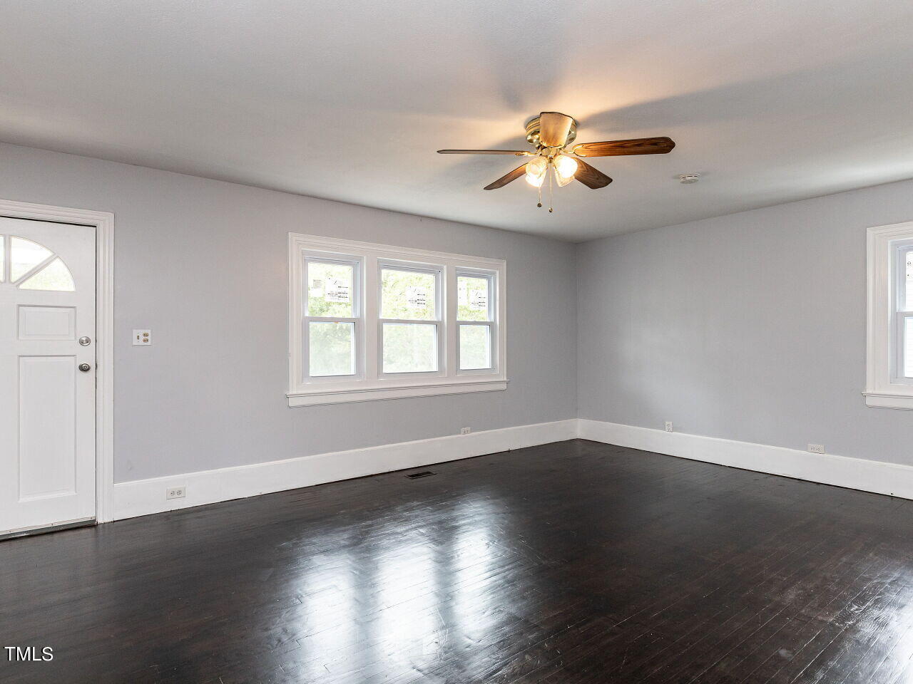 7 Ratcale Lane Durham, NC 27705 - Photo 5 of 33 a view of an empty room with wooden floor and a window