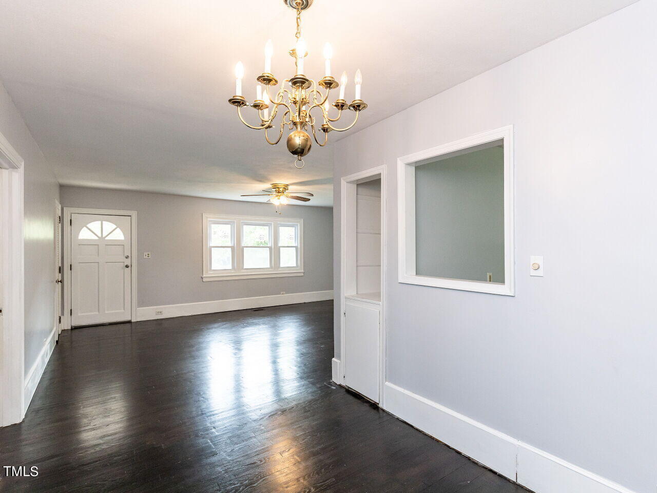 7 Ratcale Lane Durham, NC 27705 - Photo 7 of 33 a view of an empty room with wooden floor and a window