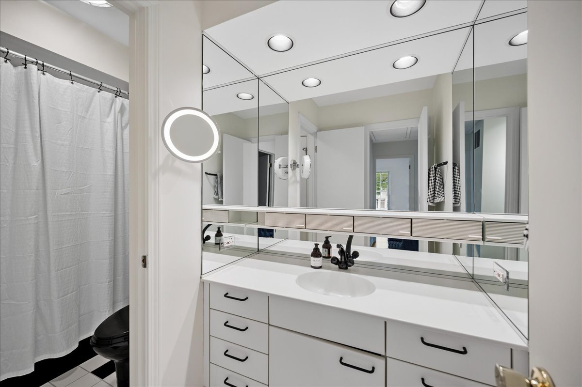 1701 Colonial Lane Northfield, IL 60093 - Photo 15 of 20 a bathroom with a double vanity sink mirror and double