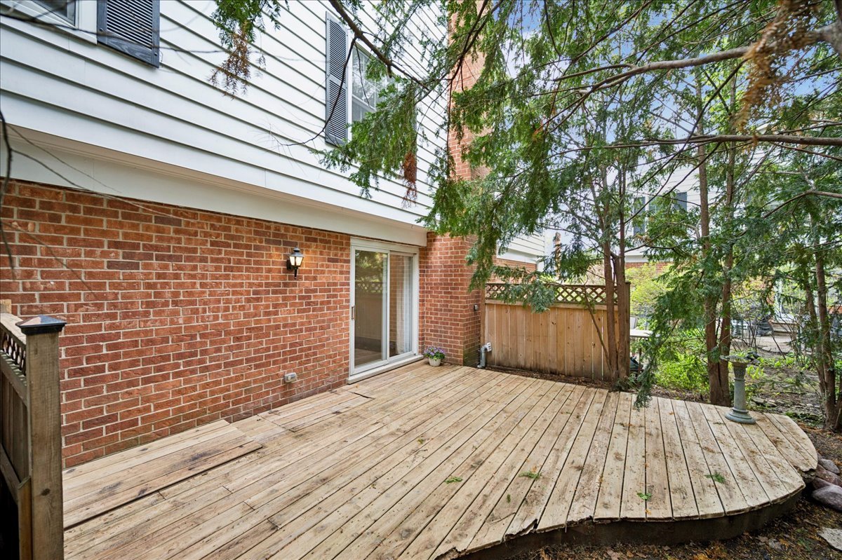 1701 Colonial Lane Northfield, IL 60093 - Photo 18 of 20 a view of backyard with barbeque grill and a large tree